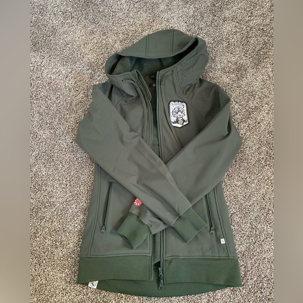 New without tags, green jacket, size XS, great for winter activities